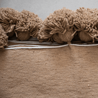 Manta con pompones de Zoco Home | Arena
