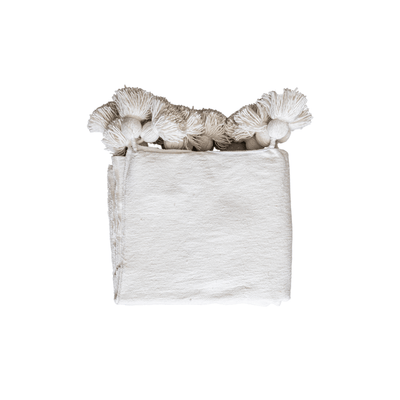 Manta con pompones de Zoco Home | Blanca